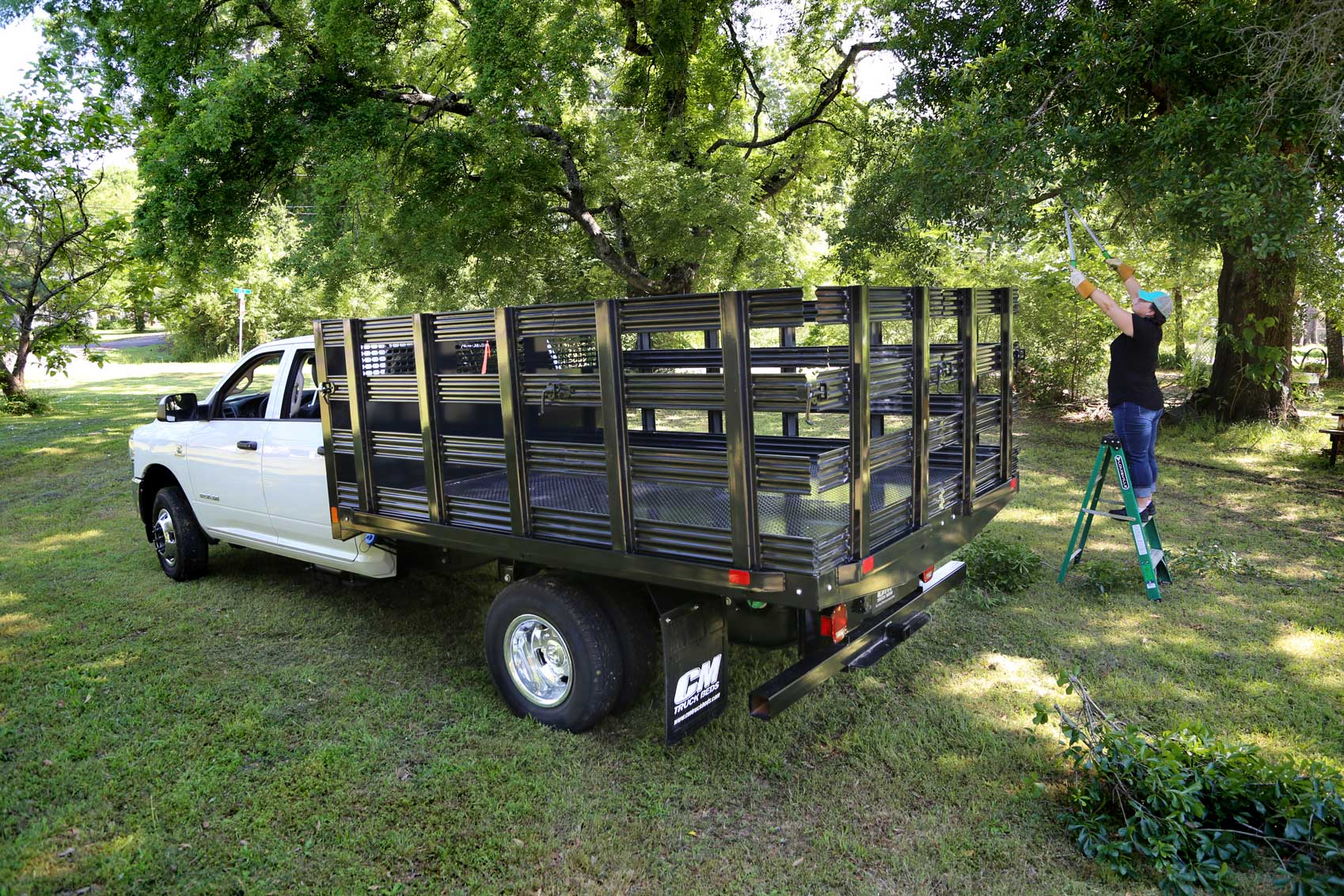 PL truck bed with side stake option in use on landscape job