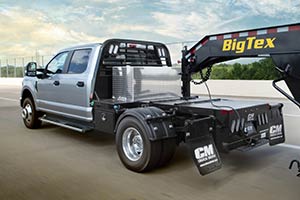 CM Truck Beds HotShot Model on highway hauling Big Tex Trailer
